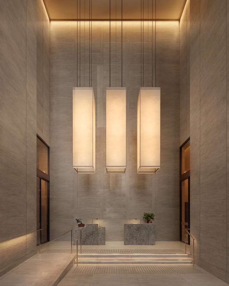 Artist’s impression of the AURA lobby entry, a double-height travertine hall lit by three tall alabaster pendants above a pair of stone reception desks