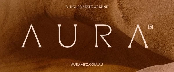 The AURA wordmark on a rippled sand background, above the tagline “A higher state of mind”