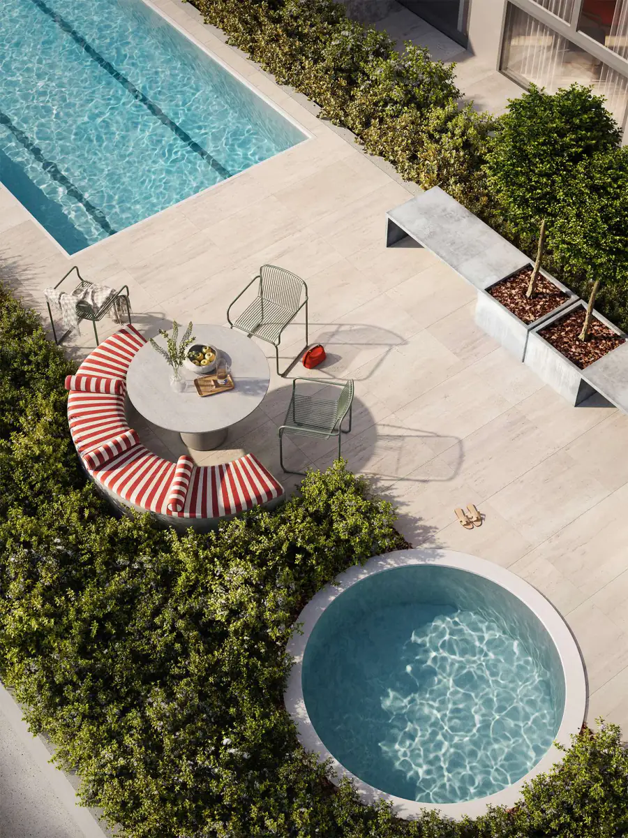 Looking down on the pool terrace, with a lap pool, plunge pool and shaded seating