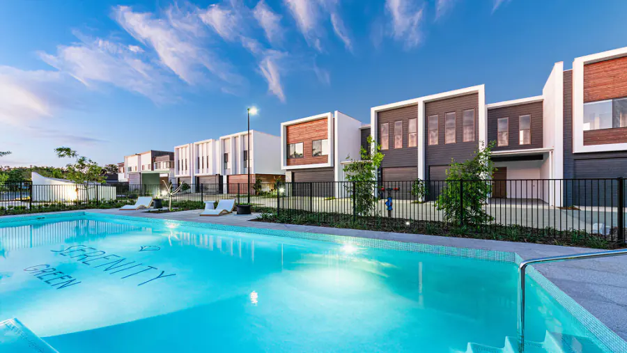 Resort pool at Serenity 4212 with white terrace homes behind